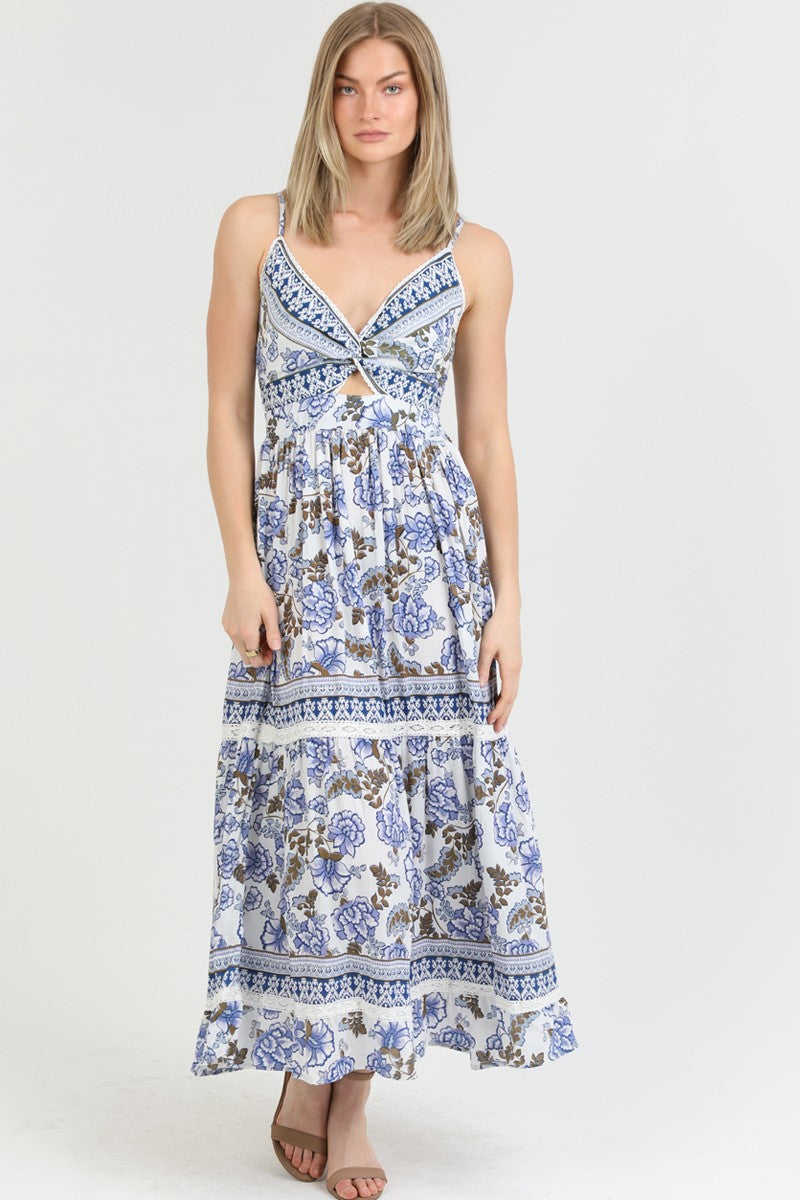 a bohemian floral maxi dress with a front knot and tiered skirt.
