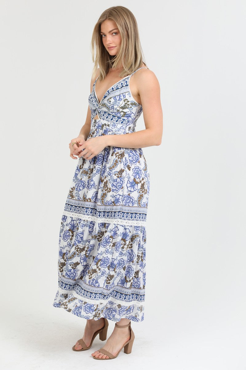 a bohemian floral maxi dress with a front knot and tiered skirt.
