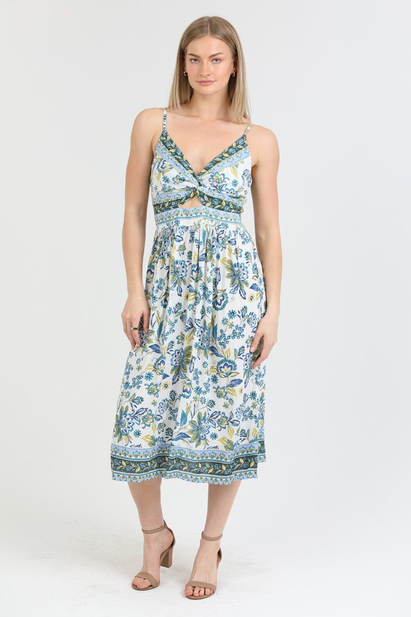 floral midi dress with a twist-front bodice, adjustable straps, and side slit, styled for a summer look.