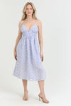 light blue eyelet midi dress with a deep V-neck and tie-back detail
