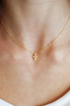 18K gold-plated 925 sterling silver dainty cross necklace with cubic zirconia accents on a delicate chain, perfect for everyday wear and faith-inspired jewelry.