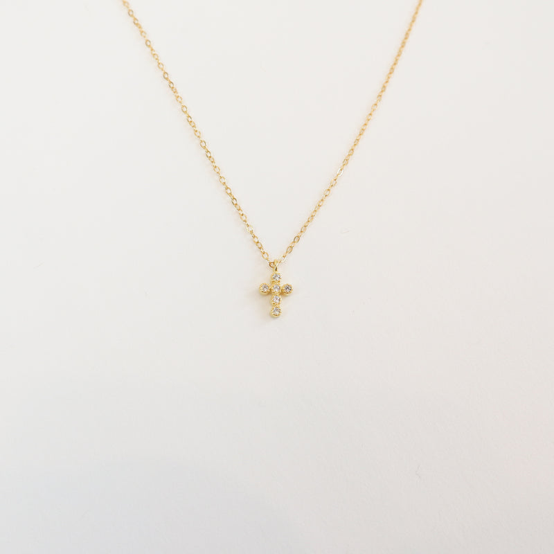 18K gold-plated 925 sterling silver dainty cross necklace with cubic zirconia accents on a delicate chain, perfect for everyday wear and faith-inspired jewelry.