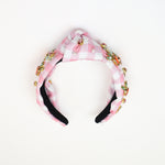 Pink and white gingham knotted headband with pearl and rhinestone embellishments