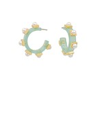 Sage green hoop earrings with pearl embellishments and gold accents, designed for a bold yet elegant statement.