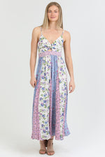 Front view of the Flora Charm Maxi dress, featuring a flattering twisted front and floral print.