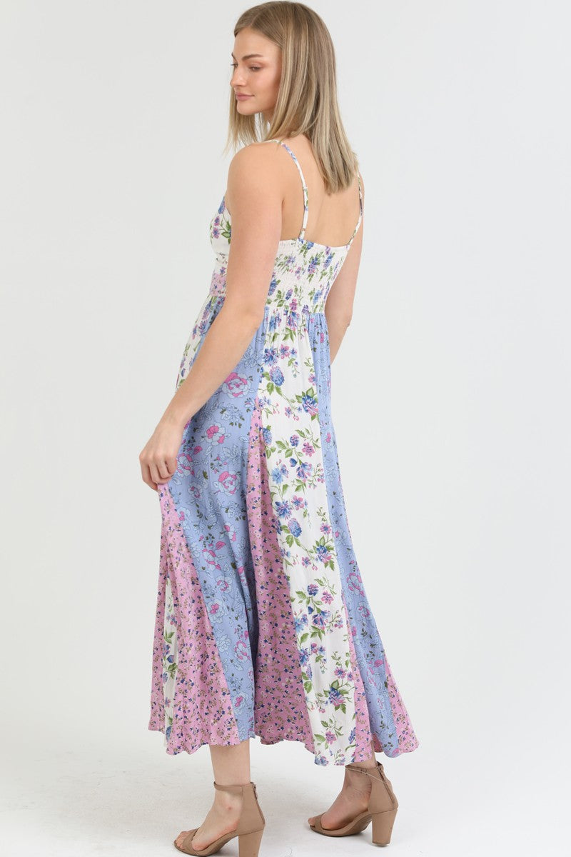 Front view of the Flora Charm Maxi dress, featuring a flattering twisted front and floral print.