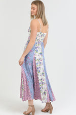 Front view of the Flora Charm Maxi dress, featuring a flattering twisted front and floral print.