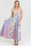 Front view of the Flora Charm Maxi dress, featuring a flattering twisted front and floral print.