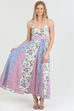 Front view of the Flora Charm Maxi dress, featuring a flattering twisted front and floral print.