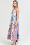 Front view of the Flora Charm Maxi dress, featuring a flattering twisted front and floral print.