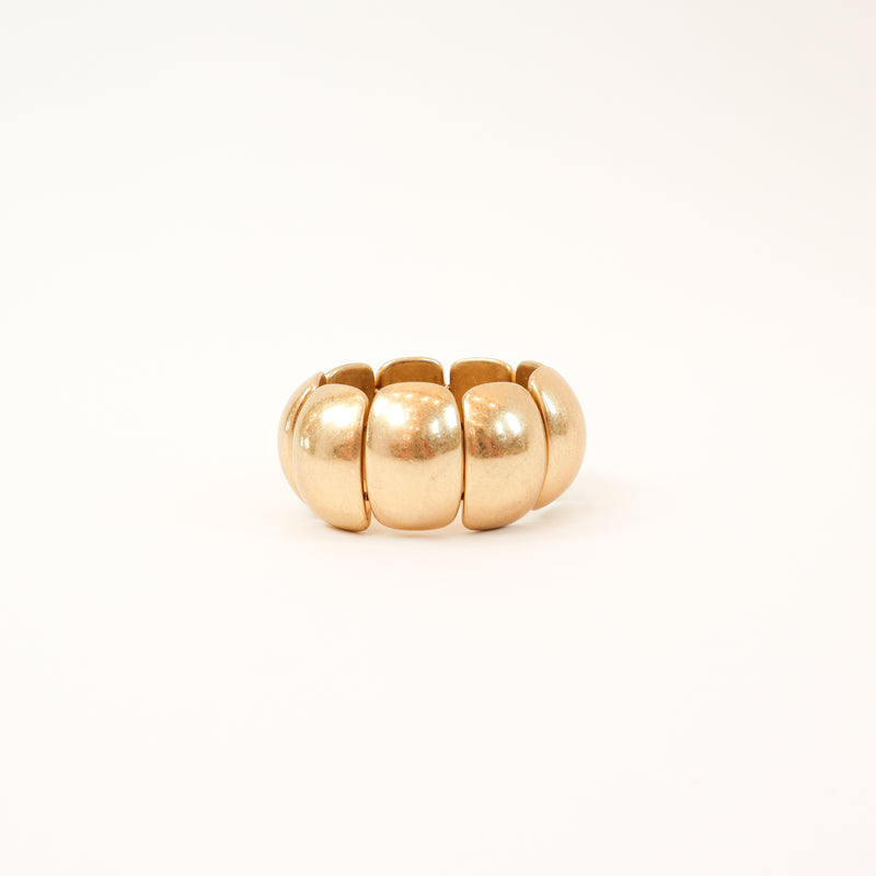 A bold and stylish chunky stretch bracelet featuring dome-shaped panels in gold or silver, adding a statement-making touch to any outfit.
