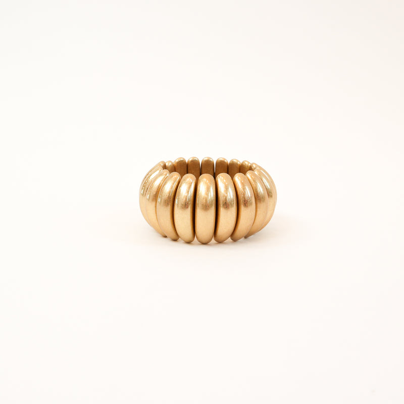 A bold and stylish chunky stretch bracelet featuring dome-shaped panels in gold or silver, adding a statement-making touch to any outfit.