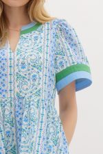  blue and green paisley-print cotton dress with contrast trim, a V-neckline, and structured short sleeves, evoking a fresh and breezy summer aesthetic.